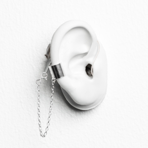 White ear mould with silver cuff earring and chain